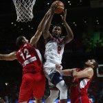 Serbia's Nenad Krstic, left tries to block United States' Rudy Gay as he pushes the ball up to the basket during the final World Basketball match between the United States and Serbia at the Palacio de los Deportes stadium in Madrid, Spain, Sunday, Sept. 14, 2014. (AP Photo/Andres Kudacki)