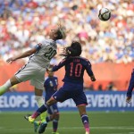United States' Abby Wambach, left, goes for a header against Japan's Homare Sawa (10) during the second half of the FIFA Women's World Cup soccer championship in Vancouver, British Columbia, Canada, Sunday, July 5, 2015. The U.S. beat Japan 5-2. (AP Photo/Elaine Thompson)