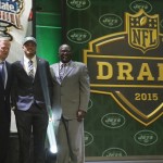 Ohio State wide receiver Devin Smith poses for photos with NFL commissioner Roger Goodell, left, and former New York Jets players Emerson Boozer after being selected by the Jets as the 37th pick in the second round of the 2015 NFL Football Draft, Friday, May 1, 2015, in Chicago. (AP Photo/Charles Rex Arbogast)