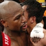 Floyd Mayweather Jr., left, and Manny Pacquiao, from the Philippines, embrace in the ring at the finish of their welterweight title fight on Saturday, May 2, 2015 in Las Vegas. (AP Photo/John Locher)