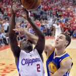  Los Angeles Clippers guard Darren Collison, left, puts up a shot as Golden State Warriors guard Klay Thompson defends during the second half in Game 1 of an opening-round NBA basketball playoff series, Saturday, April 19, 2014, in Los Angeles. The Warriors won 109-105. (AP Photo/Mark J. Terrill)