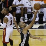 San Antonio Spurs guard Tony Parker (9) scores as Miami Heat forward LeBron James (6) watches during the first half in Game 3 of the NBA basketball finals, Tuesday, June 10, 2014, in Miami. (AP Photo/Lynne Sladky)