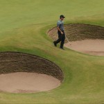 Charl Schwartzel of South Africa walks to a bunker on the 18th green to play his shot during the third day of the British Open Golf championship at the Royal Liverpool golf club, Hoylake, England, Saturday July 19, 2014. (AP Photo/Peter Morrison)