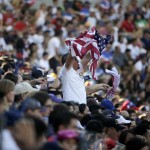 A fan waves an American flag while watching a friendly soccer match between Panama and the United States, Sunday, Feb. 8, 2015, in Carson, Calif. The United States won 2-0. (AP Photo/Jae C. Hong)