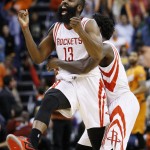Houston Rockets' James Harden (13) celebrates with Patrick Beverley, rear, after his game-winning shot against the Phoenix Suns in an NBA basketball game Friday, Jan. 23, 2015, in Phoenix. The Rockets defeated the Suns 113-111. (AP Photo/Ross D. Franklin)