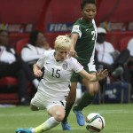 United States' Megan Rapinoe fights for control of the ball with Nigeria's Esther Sunday during the first half of a FIFA Women's World Cup soccer match, Tuesday, June 16, 2015 in Vancouver, New Brunswick, Canada (Jonathan Hayward/The Canadian Press via AP)