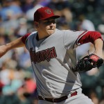 Arizona Diamondbacks starting pitcher Trevor Cahill throws to the plate against the Colorado Rockies during the first inning of a baseball game Saturday, Sept. 20, 2014, in Denver. (AP Photo/Jack Dempsey)