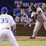 San Francisco Giants' Pablo Sandoval hits an RBI single during the seventh inning of Game 1 of baseball's World Series against the Kansas City Royals Tuesday, Oct. 21, 2014, in Kansas City, Mo. (AP Photo/Charlie Riedel)