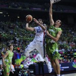 Dominican Republic's James Feldeine, second right, vies for the ball over Slovenia's Jure Balazic during Basketball World Cup Round of 16 match between Dominican Republic and Slovenia at the Palau Sant Jordi in Barcelona, Spain, Saturday, Sept. 6, 2014. The 2014 Basketball World Cup competition will take place in various cities in Spain from Aug. 30 through to Sept. 14. (AP Photo/Manu Fernandez)