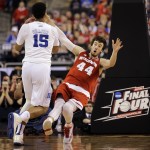 Wisconsin's Frank Kaminsky (44) falls as Duke's Jahlil Okafor (15) drives during the first half of the NCAA Final Four college basketball tournament championship game Monday, April 6, 2015, in Indianapolis. (AP Photo/David J. Phillip)