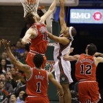 Chicago Bulls' Paul Gasol (16) blocks the shot of Milwaukee Bucks' Jared Dudley during the first half of Game 6 of an NBA basketball first-round playoff series Thursday, April 30, 2015, in Milwaukee. (AP Photo/Jeffrey Phelps)