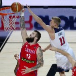 United States' Mason Plumlee, right, and Serbia's Miroslav Raduljica jump for the ball during the final World Basketball match between the United States and Serbia at the Palacio de los Deportes stadium in Madrid, Spain, Sunday, Sept. 14, 2014. (AP Photo/Manu Fernandez)