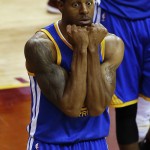 Golden State Warriors guard Andre Iguodala (9) reacts to being charged with a foul against the Cleveland Cavaliers during the second half of Game 4 of basketball's NBA Finals in Cleveland, Thursday, June 11, 2015. (AP Photo/Paul Sancya)