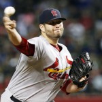 St. Louis Cardinals' Lance Lynn throws a pitch against the Arizona Diamondbacks during the first inning of a baseball game Saturday, Sept. 27, 2014, in Phoenix. (AP Photo/Ross D. Franklin)