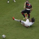 United States' Jermaine Jones collides with Germany's Bastian Schweinsteiger (7) during the group G World Cup soccer match between the USA and Germany at the Arena Pernambuco in Recife, Brazil, Thursday, June 26, 2014. (AP Photo/Hassan Ammar)
