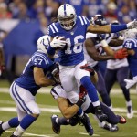Indianapolis Colts wide receiver Josh Cribbs (16) is tackled by Houston Texans inside linebacker Mike Mohamed on the opening kickoff during the first half of an NFL football game in Indianapolis, Sunday, Dec. 14, 2014. (AP Photo/Michael Conroy)