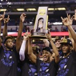 Duke players celebrate with the trophy after their 68-63 victory over Wisconsin in the NCAA Final Four college basketball tournament championship game Monday, April 6, 2015, in Indianapolis. (AP Photo/Michael Conroy)