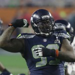 Seattle Seahawks defensive tackle Tony McDaniel (99) flexes his arm after tackling New England Patriots running back LeGarrette Blount during the second half of NFL Super Bowl XLIX football game Sunday, Feb. 1, 2015, in Glendale, Ariz. (AP Photo/Elise Amendola)