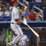  Arizona Diamondbacks' Aaron Hill watches his two-run home run against the Miami Marlins during the first inning of a baseball game in Miami, Friday, Aug. 15, 2014. (AP Photo/J Pat Carter)