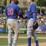 Actor Will Ferrell, right, replaces Chicago Cubs first baseman Mike Olt during a spring training baseball exhibition game against the Los Angeles Angels in Tempe, Ariz., on Thursday, March 12, 2015. The comedian plans to play every position while making appearances at five Arizona spring training games on Thursday. (AP Photo/Chris Carlson)