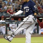 Milwaukee Brewers' Carlos Gomez flips his bat in the air after striking out against the Arizona Diamondbacks during the first inning of a baseball game Friday, July 24, 2015, in Phoenix. (AP Photo/Ross D. Franklin)