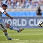 Argentina's Lionel Messi takes a free kick during the group F World Cup soccer match between Argentina and Iran at the Mineirao Stadium in Belo Horizonte, Brazil, Saturday, June 21, 2014. (AP Photo/Martin Meissner)
