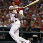 St. Louis Cardinals' Shane Robinson watches his two-run double during the sixth inning of a baseball game against the Arizona Diamondbacks on Thursday, May 22, 2014, in St. Louis. (AP Photo/Jeff Roberson)
