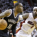 Brooklyn Nets guard Marcus Thornton (10) drives to the basket around Miami Heat forward LeBron James (6) during the second half of Game 2 of an Eastern Conference semifinal basketball game, Thursday, May 8, 2014 in Miami. The Heat defeated the Nets 94-82. (AP Photo/Wilfredo Lee)