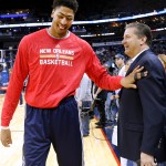 New Orleans Pelicans forward Anthony Davis talks to his former coach, John Calipari, before an NBA basketball game between the Pelicans and the Phoenix Suns, Tuesday, Dec. 30, 2014, in New Orleans. (AP Photo/Jonathan Bachman)