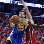 Golden State Warriors guard Stephen Curry (30) goes to the basket against New Orleans Pelicans forward Ryan Anderson (33) during the first half of Game 3 of a first-round NBA basketball playoff series in New Orleans, Thursday, April 23, 2015. (AP Photo/Gerald Herbert)