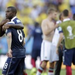 France's Rio Mavuba walks off the pitch with his teammate Mathieu Valbuena (8) after Germany defeated France 1-0 to advance to the semifinals during the World Cup quarterfinal soccer match at the Maracana Stadium in Rio de Janeiro, Brazil, Friday, July 4, 2014. (AP Photo/Matthias Schrader)