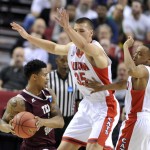 Texas Southern guard Deverell Biggs, left, is double-teamed by Arizona guard Parker Jackson-Cartwright, right, and center Kaleb Tarczewski during the first half in the second round of the NCAA college basketball tournament in Portland, Ore., Thursday, March 19, 2015. (AP Photo/Greg Wahl-Stephens)