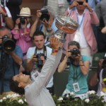 Spain's Rafael Nadal holds the trophy after winning the final of the French Open tennis tournament against Serbia's Novak Djokovic at the Roland Garros stadium, in Paris, France, Sunday, June 8, 2014. Nadal won in four sets 3-6, 7-5, 6-2, 6-4. (AP Photo/Thibaut Camus)