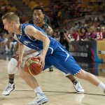 Finland's Mikko Koivisto, front, controls the ball beside United States's Derrick Rose, during their match at the Basketball World Cup in Bilbao, northern Spain, Saturday, Aug. 30, 2014. (AP Photo/Alvaro Barrientos)