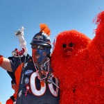 Denver Broncos fans' Chuck DeVorss, front left, and Kerry Green tailgate prior to an NFL football game against the Arizona Cardinals, Sunday, Oct. 5, 2014, in Denver. (AP Photo/David Zalubowski)