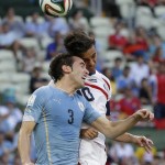Uruguay's Diego Godin, left, and Costa Rica's Bryan Ruiz challenge for a header during the group D World Cup soccer match between Uruguay and Costa Rica at the Arena Castelao in Fortaleza, Brazil, Saturday, June 14, 2014.(AP Photo/Christophe Ena)