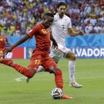 Belgium's Divock Origi has a shot on goal during the World Cup round of 16 soccer match between Belgium and the USA at the Arena Fonte Nova in Salvador, Brazil, Tuesday, July 1, 2014. United States' Omar Gonzalez (3) is chasing the play. (AP Photo/Matt Dunham)