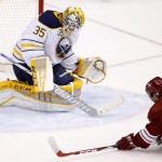 Buffalo Sabres' Anders Lindback (35), of Sweden, makes a save on a shot by Arizona Coyotes' Tobias Rieder (8), of Germany, during the second period of an NHL hockey game Monday, March 30, 2015, in Glendale, Ariz. (AP Photo/Ross D. Franklin)