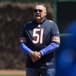 Chicago Bears Hall of Fame linebacker Dick Butkus is recognized before the Arizona Diamondbacks faced the Chicago Cubs on the 100th anniversary of the first baseball game at Wrigley Field, Wednesday, April 23, 2014, in Chicago. (AP Photo/Andrew A. Nelles)