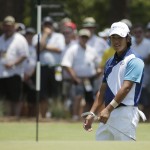 Hideki Matsuyama, of Japan, reacts to his chip on the first hole during the final round of the U.S. Open golf tournament in Pinehurst, N.C., Sunday, June 15, 2014. (AP Photo/Charlie Riedel)