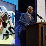 Former NFL player Pat Terrell announces that the Carolina Panthers selects Michigan wide receiver Devin Funchess as the 41st pick in the second round of the 2015 NFL Football Draft, Friday, May 1, 2015, in Chicago. (AP Photo/Charles Rex Arbogast)