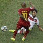 Ghana's Andre Ayew, front, and Germany's Sami Khedira challenge for the ball during the group G World Cup soccer match between Germany and Ghana at the Arena Castelao in Fortaleza, Brazil, Saturday, June 21, 2014. (AP Photo/Themba Hadebe)