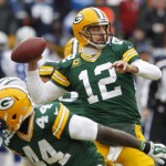 Green Bay Packers quarterback Aaron Rodgers (12) throws a pass during the first half of an NFL divisional playoff football game against the Dallas Cowboys Sunday, Jan. 11, 2015, in Green Bay, Wis. (AP Photo/Matt Ludtke)