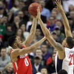 Ohio State guard D'Angelo Russell, left, shoots against Arizona forward Brandon Ashley during an NCAA college basketball tournament round of 32 game in Portland, Ore., Saturday, March 21, 2015. (AP Photo/Craig Mitchelldyer)