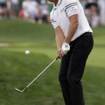 Henrik Stenson, of Sweden, hits a chip on the fourth hole during the third round of the PGA Championship golf tournament at Valhalla Golf Club on Saturday, Aug. 9, 2014, in Louisville, Ky. (AP Photo/David J. Phillip)