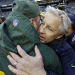 Green Bay Packers head coach Mike McCarthy, left, hugs Seattle Seahawks head coach Pete Carroll after overtime of the NFL football NFC Championship game Sunday, Jan. 18, 2015, in Seattle. The Seahawks won 28-22 to advance to Super Bowl XLIX. (AP Photo/David J. Phillip)