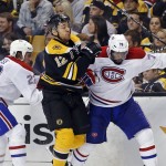  Boston Bruins right wing Jarome Iginla (12) grapples along the boards with Montreal Canadiens right wing Dale Weise (22) and defenseman P.K. Subban during the second period in Game 1 of an NHL hockey second-round playoff series in Boston, Thursday, May 1, 2014. (AP Photo/Elise Amendola)