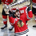 Chicago Blackhawks' Antoine Vermette hoists the Stanley Cup trophy after defeating the Tampa Bay Lightning in Game 6 of the NHL hockey Stanley Cup Final series on Wednesday, June 10, 2015, in Chicago. The Blackhawks defeated the Lightning 2-0 to win the series 4-2. (AP Photo/Charles Rex Arbogast)
