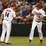 Arizona Diamondbacks A.J. Pollock, right, celebrates with third base coach Andy Green in the seventh inning after hitting a two-run home run against the Atlanta Braves during a baseball game, Tuesday, June 2, 2015, in Phoenix. (AP Photo/Rick Scuteri)