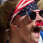 A U.S. fan cheers while watching the team warm up for a FIFA Women's World Cup soccer game between Nigeria and the United States, Tuesday, June 16, 2105, in Vancouver, British Columbia, Canada. (Darryl Dyck/The Canadian Press via AP)
